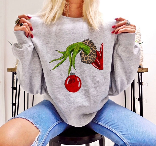 Grinch Hand Holding Red Ornament Sweatshirt